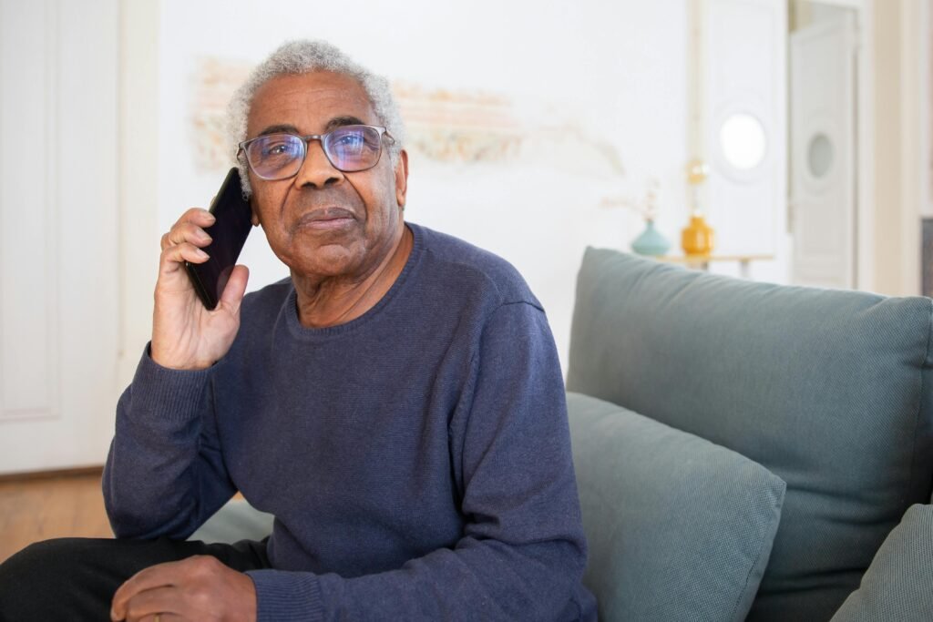 elderly man speaking on phone